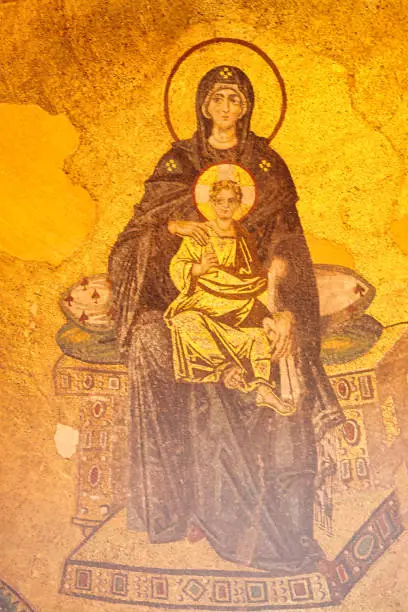 Mosaic of Virgin Mary and Infant Jesus high over the inner sanctum of the Hagia Sophia, landmark 6th centure byzantine church built by Justinian at Istanbul, Turkey