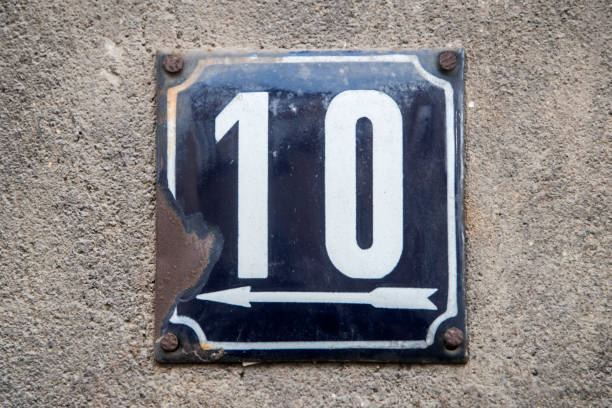 istock Weathered metal plate street number 10 1950174786