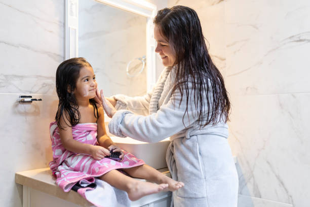 istock Mum washing her daughter's face 1950177437