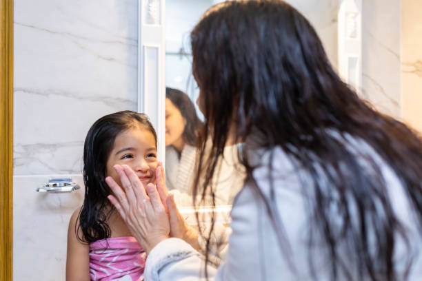 istock Mum washing her daughter's face 1950179522