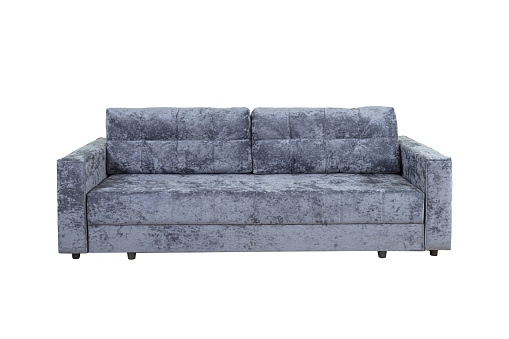 Gray sofa with velor fabric pillows isolated on a white background. Cushioned furniture.