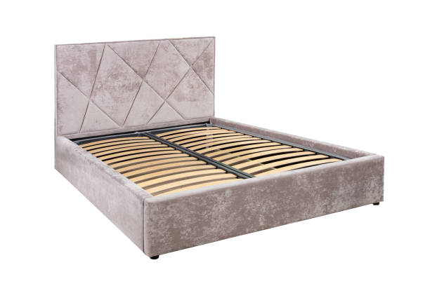istock Brown double bed with wooden base without mattress. 1950187476