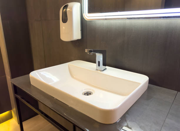 istock White washbasin with tap in the restroom 1950202801