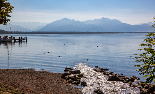 Beautiful landscape and lakeshore of lake Chiemsee in the Bavarian Alps with inflow of a small brook