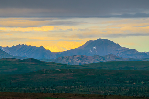 A pastel sunrise early morning in Denali National Park in Alaska.