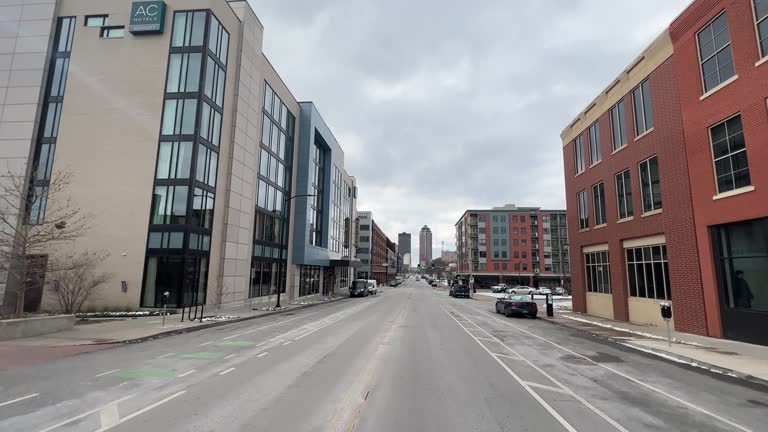 Car Point of View Shot Driving Past Small Businesses on Grand Avenue in Des Moines, IA on a Cloudy, Gray Day