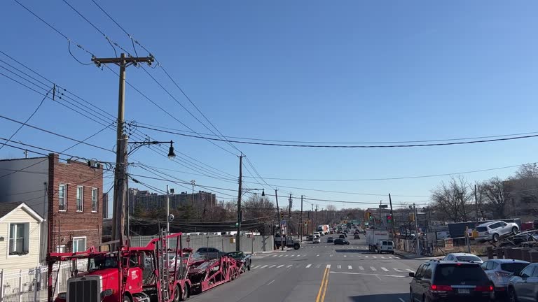 Car Point of View Shot Driving Down a Busy Road in East Bronx, New York on a Clear Day