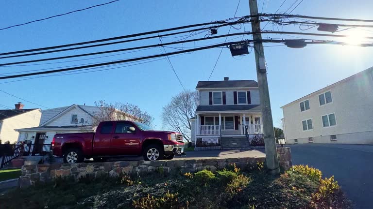 Side Car Point of View of a Neighborhood Full of Large Homes in Greenwich, Connecticut on a Sunny Day