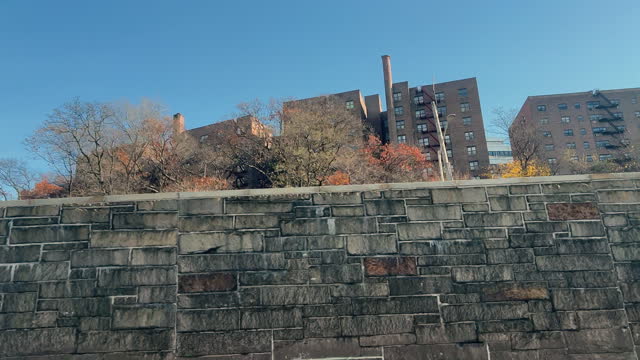 Side View From a Car Window on I-87 (Interstate 87) Bruckner Blvd of Large Apartment Buildings in West Bronx, New York on a Clear Day