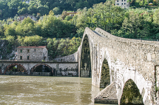 Bridge of the Devil or Ponte della Maddalena historic landmark in Garfagnana. Serchio river. Borgo a Mozzano, Lucca. Tuscany, Italy