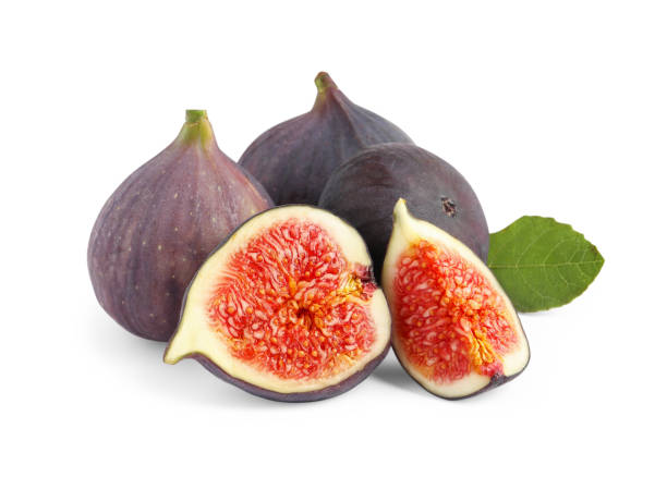 istock Cut and whole ripe figs isolated on white 1950287189