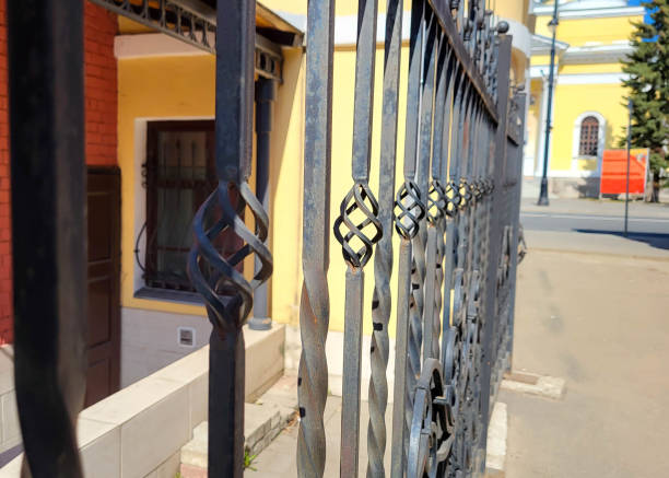 Ornate iron grating with a twisted pattern. Abstract exterior architectural background