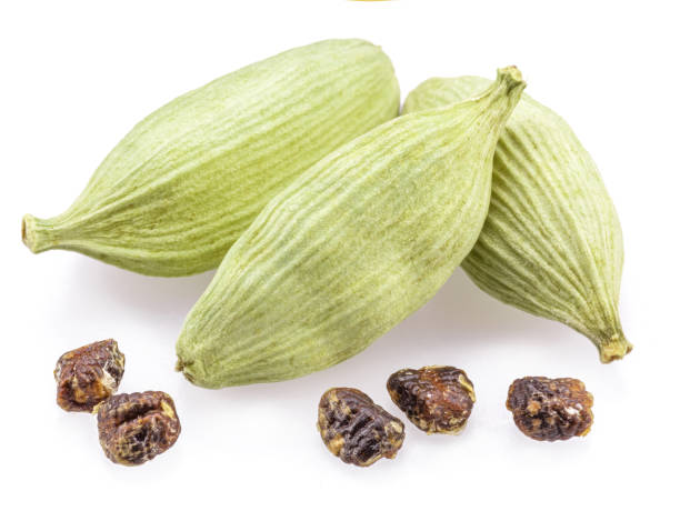 istock Green cardamom pods and seeds isolated on white background. 1950290415