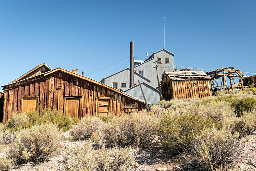Abandoned mining building in the arid desert landscape of Bodie State Park Ghost Town California, USA