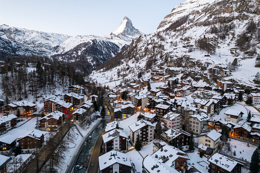 Aerial view of snow covered, Swiss mountain village in winter