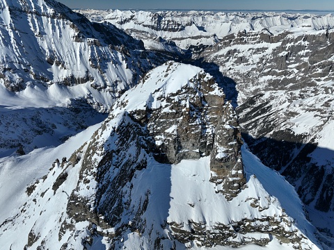 Aerial view of snowcapped mountains and peaks