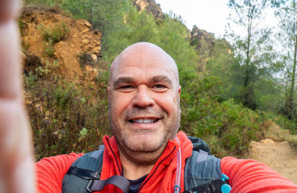 istock Hiker man takes a photo selfie 1950388570