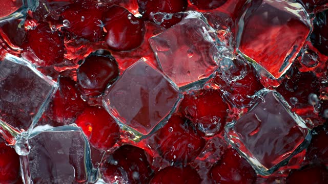Super Slow Motion Shot of Water Wave Splashing on Cherries and Ice Cubes at 1000fps.