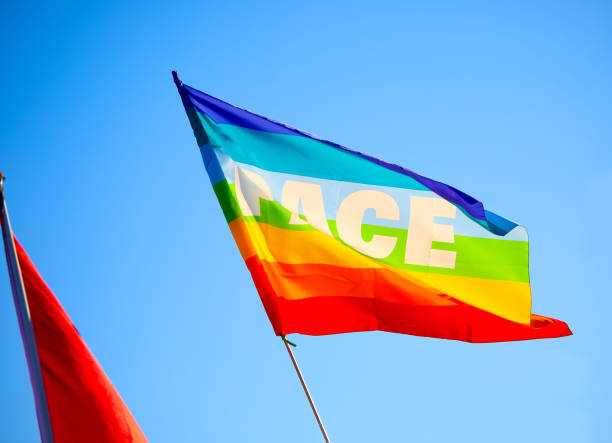 istock Peace flag with the word PACE in Italian against sky background 1950459783