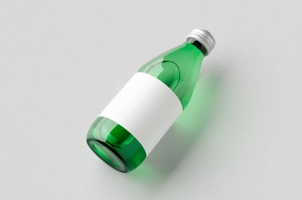 istock Water bottle mockup with a blank label. Green glass. 1950472256