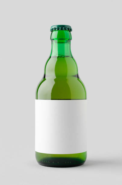 istock Green steinie beer bottle mockup with blank label. 1950474864