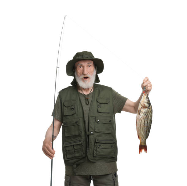 istock Fisherman with rod and catch isolated on white 1950526763