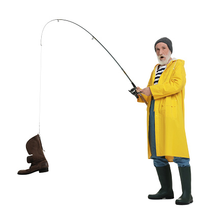 Shocked fisherman with rod and old boot isolated on white