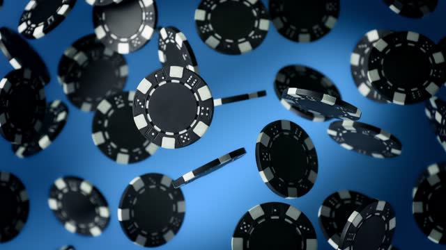 Super Slow Motion Shot of Casino Chips Explosion Towards Camera on Black Background at 1000fps.