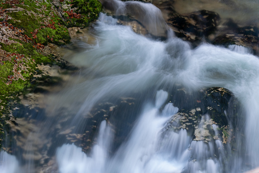 Silky flow of river water shot on low shutter speed.