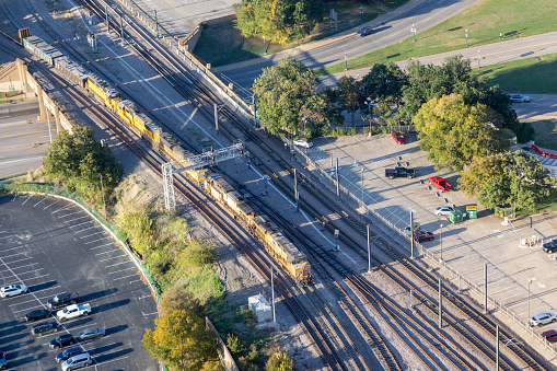Dallas, USA - November 6, 2023: aerial of rails,bridge and parking lot in late afternoon in Dallas, Texas, USA