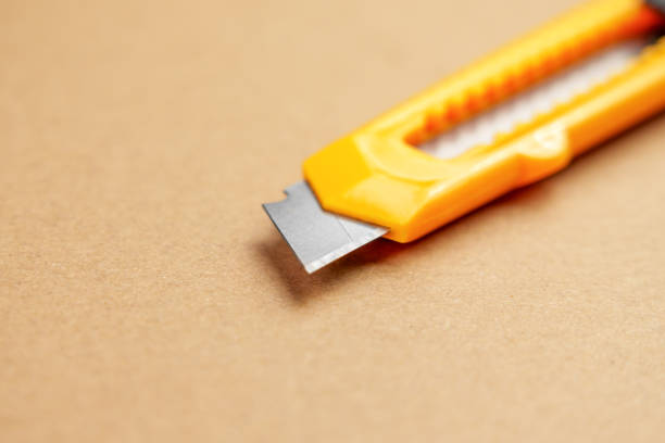 istock Utility knife or retractable box cutter for parcel unpacking 1950541185