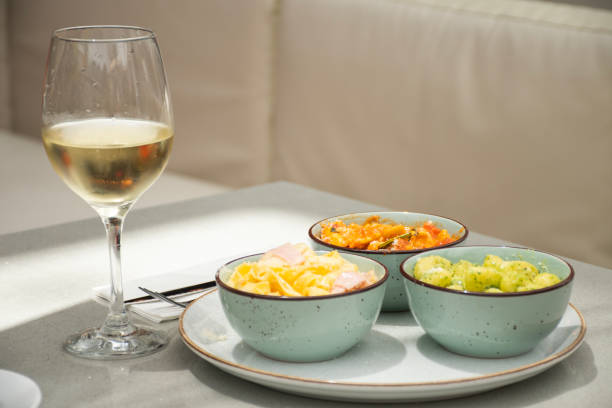 istock pairing with different pasta dishes and a glass of white wine 1950557591