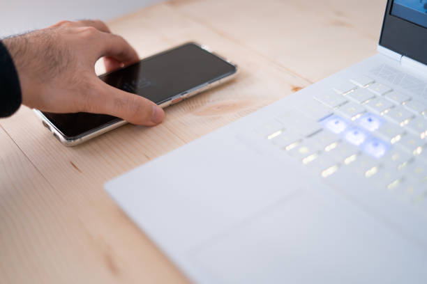 istock Phone and laptop in the office. 1950602592
