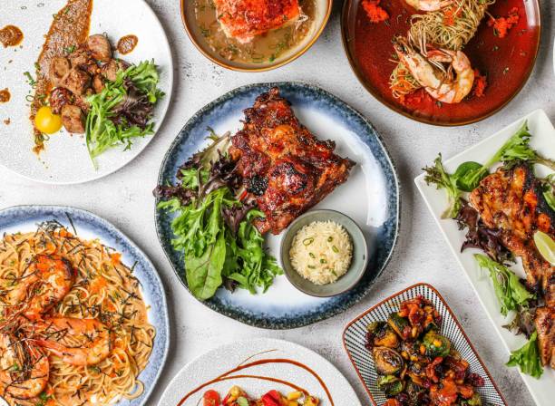 istock Grilled pork ribs with plain rice, grill beef cube tikka, prawn mentaiko pasta, prawn truffle capellini, brussel sprouts, grilled belly and watermelon salad 1950625329
