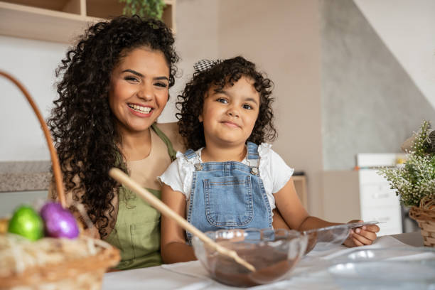 istock Portrait of mother daughter making chocolate for Easter 1950626376