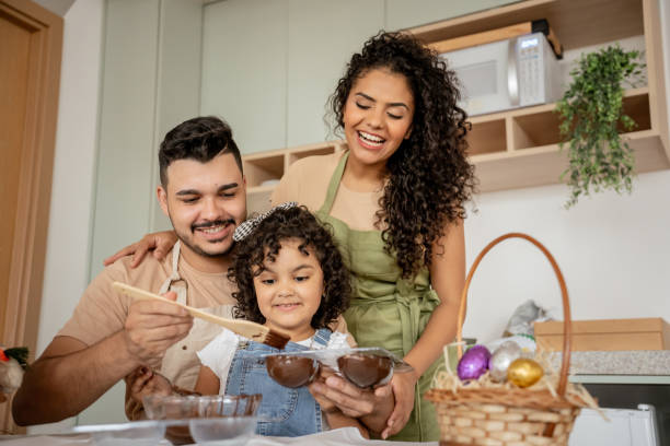 istock Family with a daughter making chocolate for Easter 1950627436