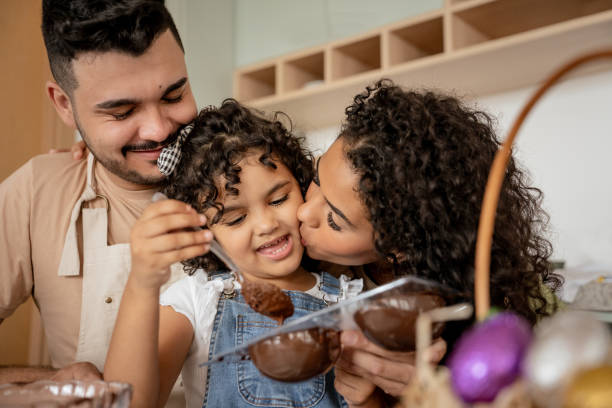 istock Family with a daughter making chocolate for Easter 1950627438