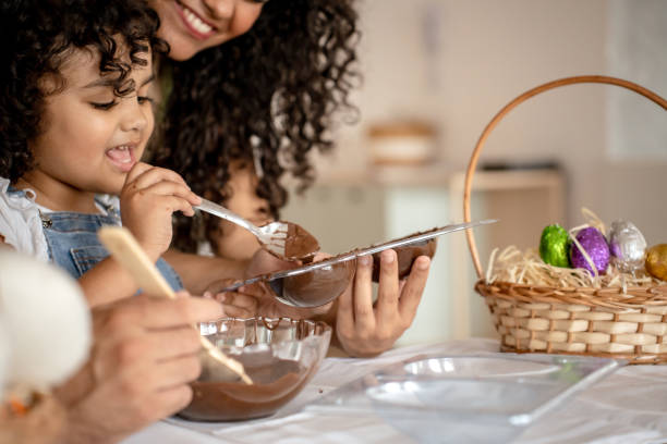 istock Family with a daughter making chocolate for Easter 1950628475