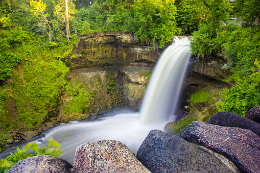 Minnehaha Falls in surrounded by greens
