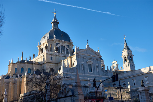 Side entrance of the Almudena cathedral, cathedral next to the royal palace in Madrid. Spain