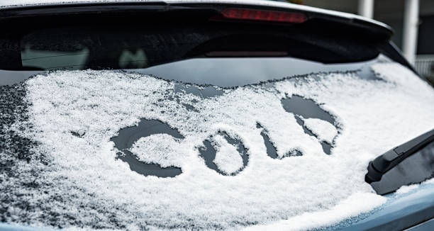 istock Close-Up of Word COLD Scraped Into Car Window Snow 1950764411