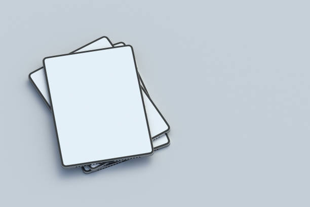 istock Stack of ebooks on gray background. Modern textbook. Digital library. Device for education. New technology. Online book, newspaper, journal or magazine. Copy space. 3d render 1950796603
