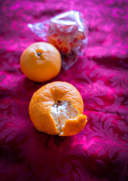 Mandarin Orange is one of the common Chinese New Year food gifts. It is believed that it brings good luck and happiness. It looks like the sun, doesn't it ? Also the color symbolizes prosperity and abundance. Are you going to eat Mandarin Oranges ?