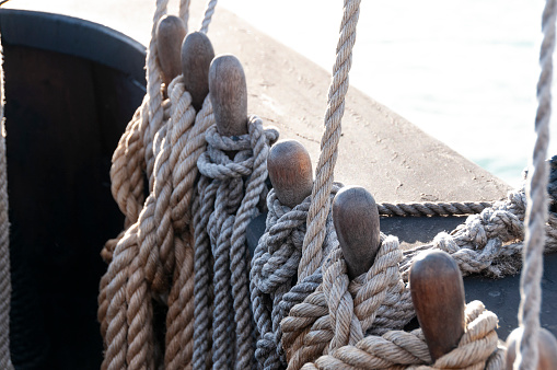 Old  harbor mooring in the background of the summer marina on a sunny day.