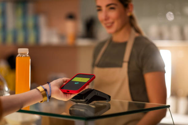 istock Paying by phone at the counter 1950869717