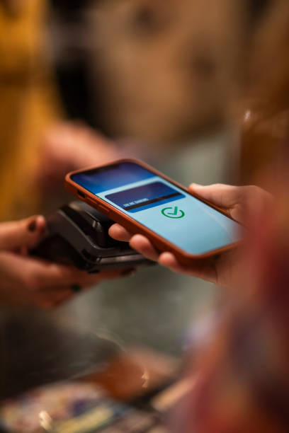 Contactless payment by smartphone stock photo