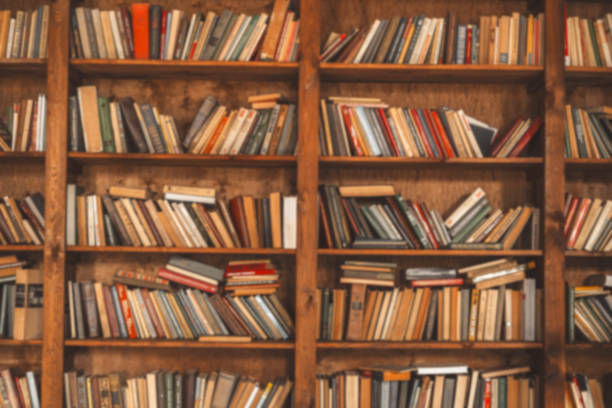 istock Wooden Shelf Filled With Books Is Presented In Library, With Front View And Blurred Image, Contributing To Historical Literature Concept. Vintage, Antiquarian Essence Of Aged And Worn Books, Classical Setting. 1950885696
