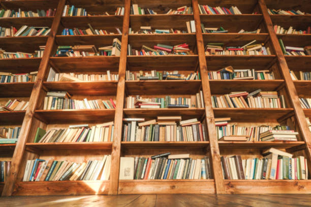 istock Vintage Library With Bottom View Of Library Shell Featuring Old Shabby Books. Blurred Image Adds Timeless And Classical Touch To Scene, Emphasizing Aged And Worn Characteristics Of Antique Books. Historic And Bookish Atmosphere. 1950886765