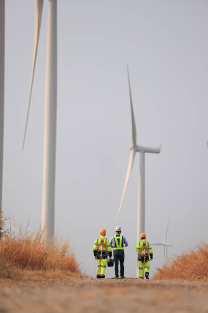 istock Wind turbine manager and technician work audit, service or maintenance, Green and renewable energy concept 1950898291