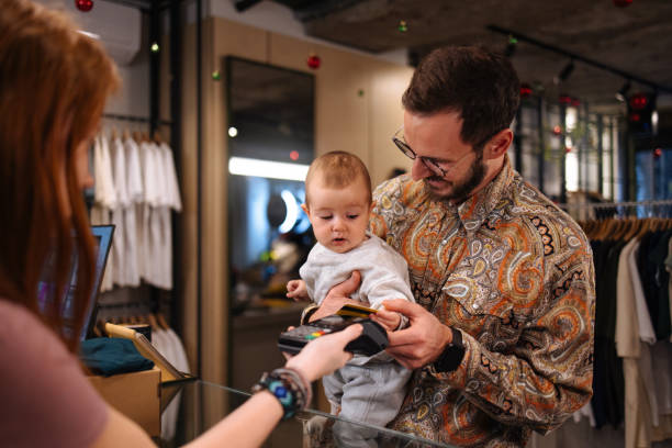 istock Father and his daughter at the store counter 1950904168